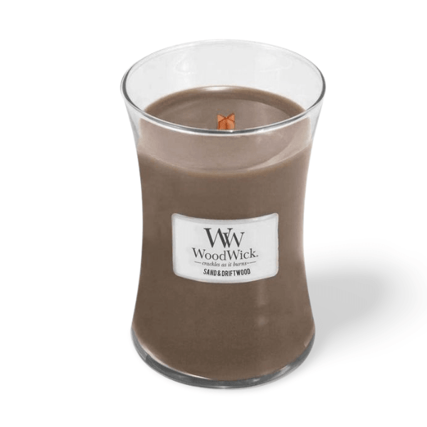 WOODWICK Sand & Driftwood candle with coastal notes of seagrass, driftwood and citrus, offering a fresh scent and crackling wick.