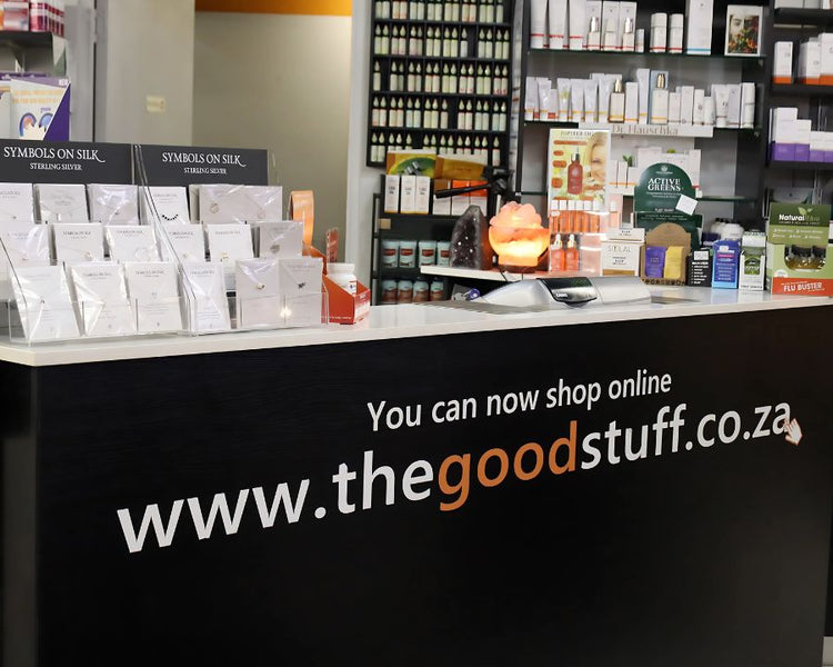 Checkout counter at The Good Stuff health and beauty shop in Claremont with wellness products and online shopping details