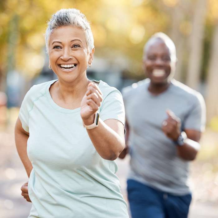 Active senior couple enjoying a run outdoors, embodying a healthy lifestyle – Medford supplements from The Good Stuff.