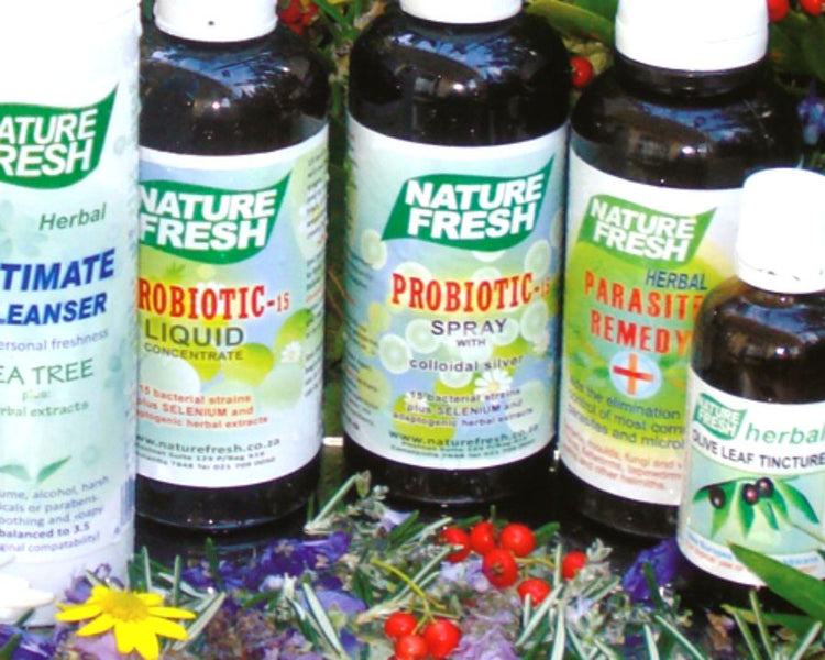 Nature Fresh bottles — Probiotic, Parasite Remedy, Olive Leaf and cleanser — natural herbal supplements on a floral background.