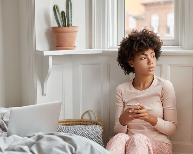 Perimenopause Supplements - The Good Stuff – woman by window; natural support for mood, sleep and hot flushes.