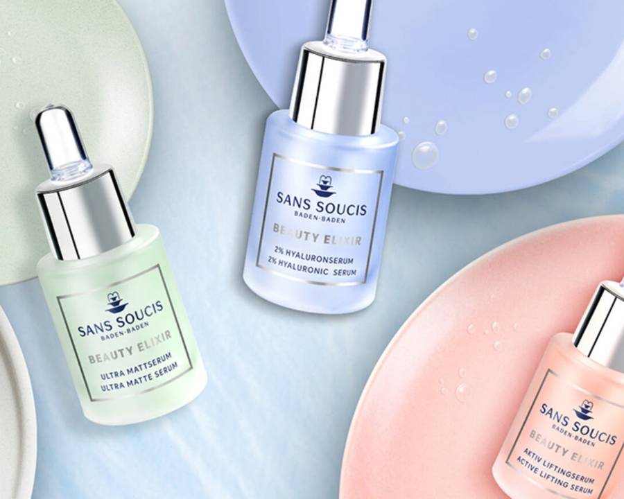 Pastel coloured plates and Sans Soucis skin care products displayed