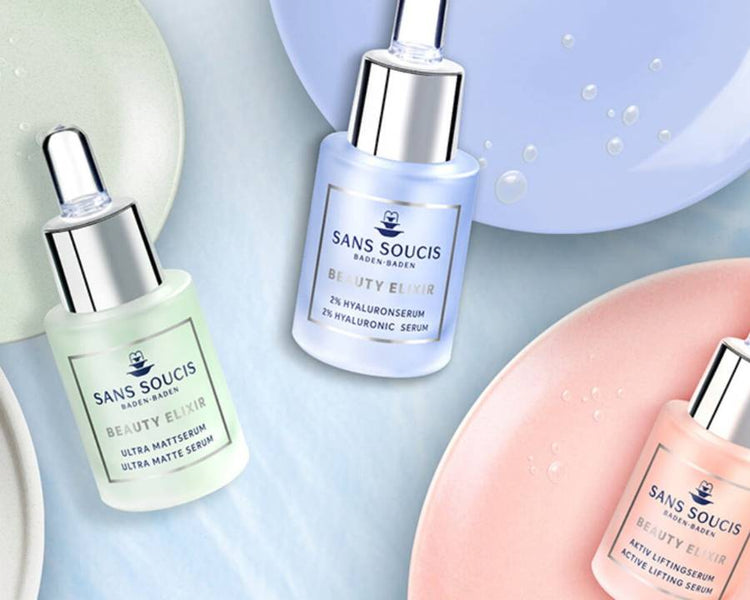 Pastel coloured plates and Sans Soucis skin care products displayed