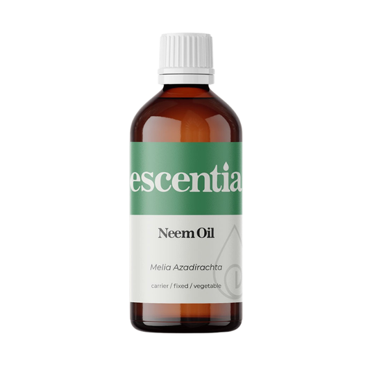 Escentia Neem Oil in an amber glass bottle, containing 100% pure cold-pressed neem oil (Melia Azadirachta) for natural skincare, scalp and hair care, moisturising dry skin, supporting blemish-prone complexions, and repelling insects.