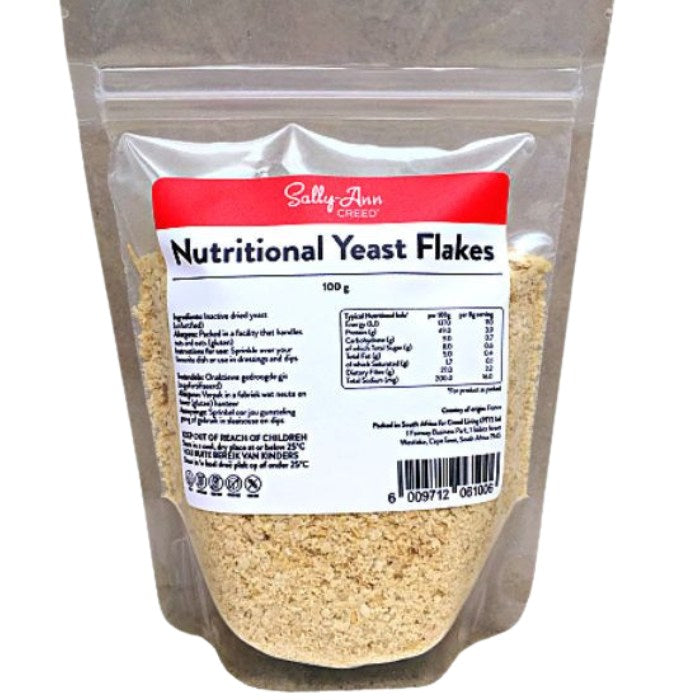 Alt tag: Packet of Sally-Ann Creed Nutritional Yeast Flakes, a vegan-friendly, protein-rich, and vitamin-packed food supplement ideal for adding flavor and nutrition to meals, 100g resealable pouch.
