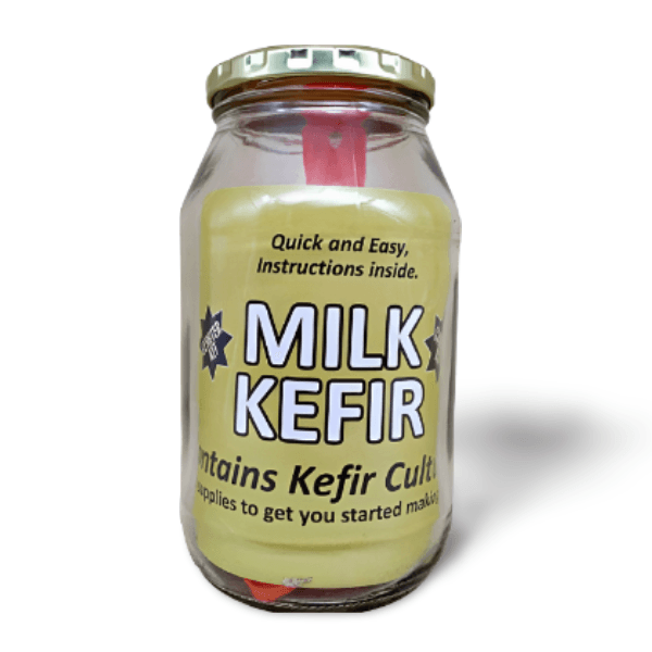 Milk Kefir Starter Kit in a glass jar with cloth sieve and wooden stirrer – clean probiotic culture for homemade gut health support.